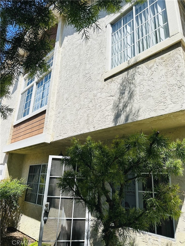 10230 Palm Glen Dr Unit 87, Santee, CA 92071 - view of property exterior with stucco siding and a balcony