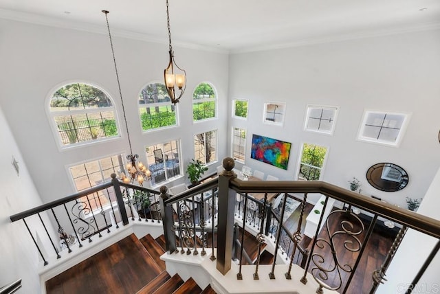 3131 Ferncreek Ln, Escondido, CA 92027 - staircase with a chandelier, a high ceiling, healthy amount of natural light, crown molding, and wood finished floors