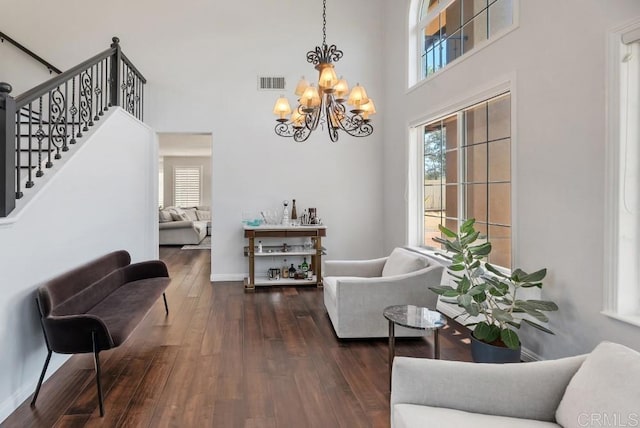 3131 Ferncreek Ln, Escondido, CA 92027 - living room with a chandelier, a high ceiling, dark wood-type flooring, and stairs