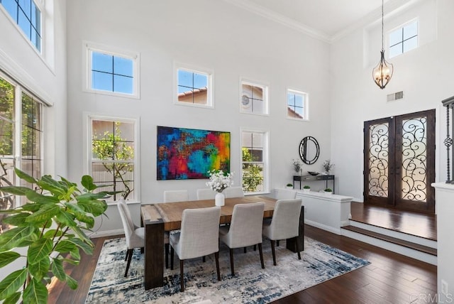 3131 Ferncreek Ln, Escondido, CA 92027 - dining area featuring a high ceiling, hardwood / wood-style floors, french doors, crown molding, and a chandelier