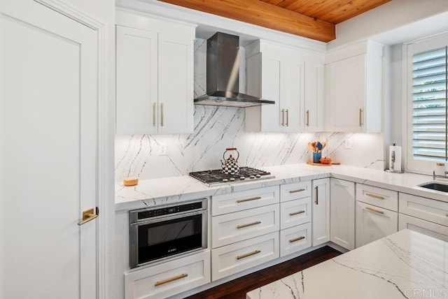 3131 Ferncreek Ln, Escondido, CA 92027 - kitchen with wall chimney exhaust hood, wooden ceiling, appliances with stainless steel finishes, white cabinets, and light stone countertops