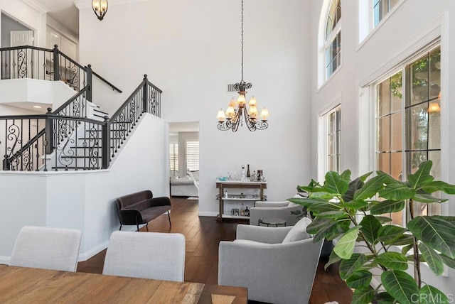 3131 Ferncreek Ln, Escondido, CA 92027 - living room with a towering ceiling, a chandelier, wood finished floors, and stairway