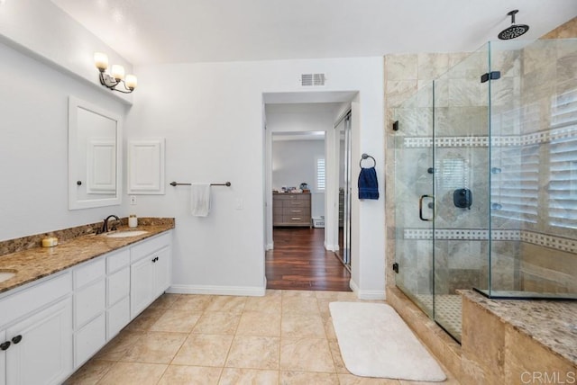 3131 Ferncreek Ln, Escondido, CA 92027 - bathroom featuring a shower stall, double vanity, and tile patterned floors