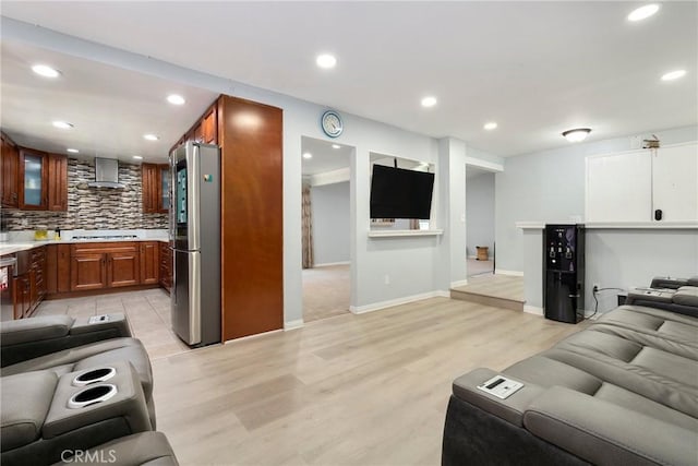 8303 Topeka Dr, Northridge, CA 91324 - living area with light wood-style floors and recessed lighting