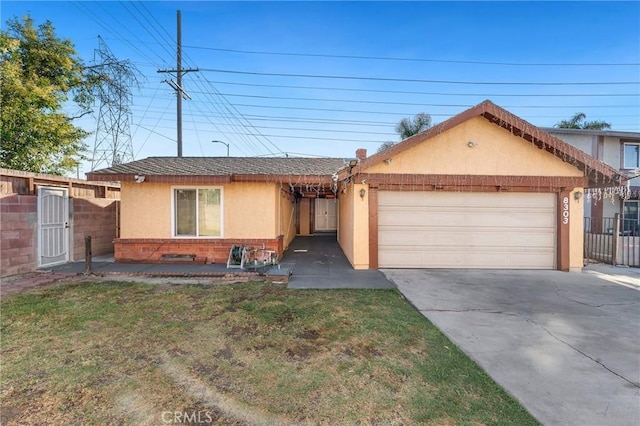 8303 Topeka Dr, Northridge, CA 91324 - view of front of house featuring stucco siding, driveway, an attached garage, brick siding, and a shingled roof