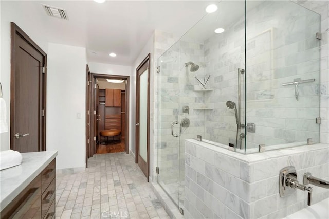 447 N Doheny Dr Unit 104, Beverly Hills, CA 90210 - bathroom featuring a stall shower, vanity, and recessed lighting