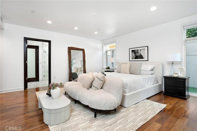 447 N Doheny Dr Unit 104, Beverly Hills, CA 90210 - bedroom with wood finished floors, multiple windows, and recessed lighting