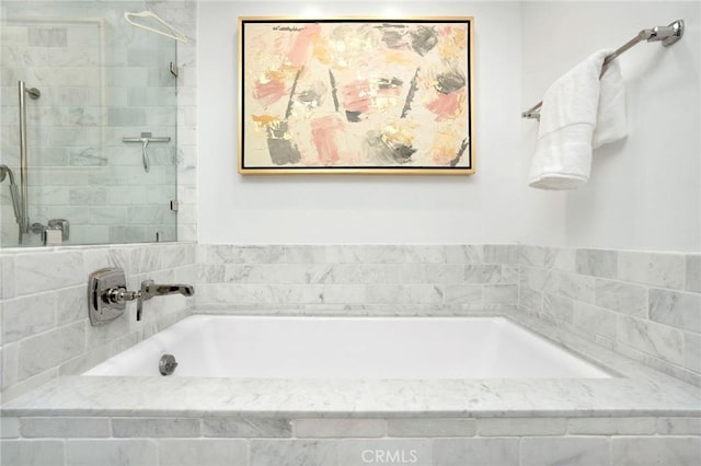 447 N Doheny Dr Unit 104, Beverly Hills, CA 90210 - bathroom featuring a garden tub and a tile shower