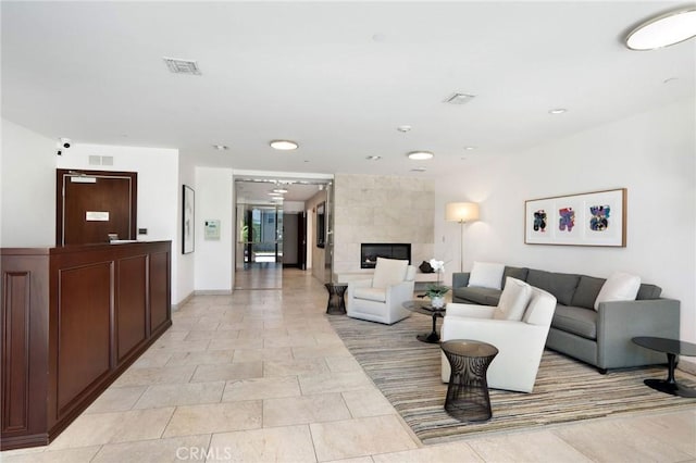 447 N Doheny Dr Unit 104, Beverly Hills, CA 90210 - living area featuring recessed lighting and a tiled fireplace