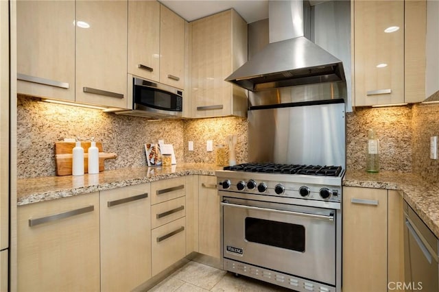 447 N Doheny Dr Unit 104, Beverly Hills, CA 90210 - kitchen featuring appliances with stainless steel finishes, wall chimney exhaust hood, light brown cabinets, and light stone countertops