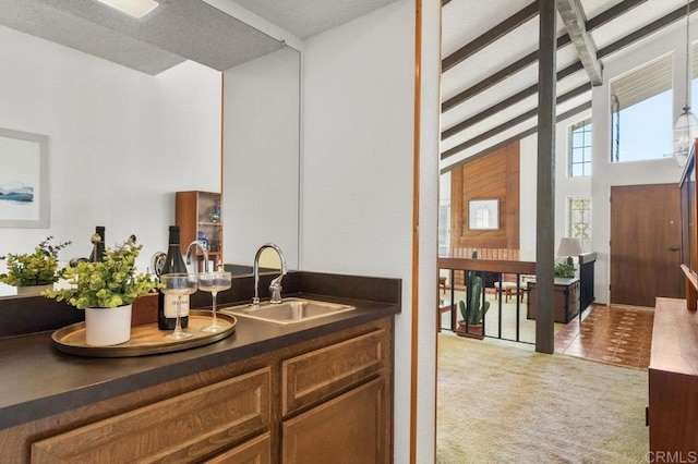 5420 Mirar Ct, Bonita, CA 91902 - bar featuring light carpet, beam ceiling, and light tile patterned floors
