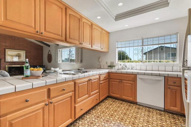 5420 Mirar Ct, Bonita, CA 91902 - kitchen with dishwasher, stainless steel gas stovetop, recessed lighting, a brick fireplace, and tile counters