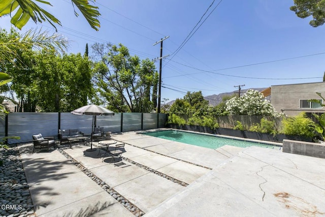 10609 Fernglen Ave, Tujunga, CA 91042 - view of swimming pool featuring a patio, a fenced backyard, and an outdoor living space