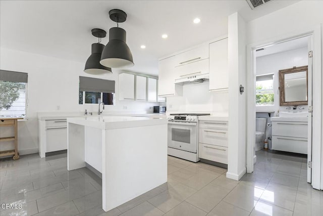10609 Fernglen Ave, Tujunga, CA 91042 - kitchen featuring white range with electric stovetop, white cabinets, light countertops, light tile patterned floors, and recessed lighting