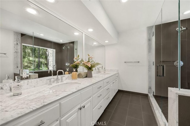 11601 Montana Ave Unit 7, Los Angeles, CA 90049 - full bath with double vanity, a shower stall, recessed lighting, and tile patterned flooring