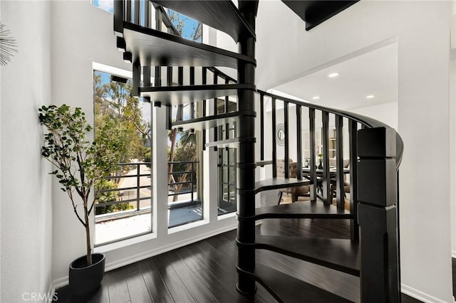 11601 Montana Ave Unit 7, Los Angeles, CA 90049 - staircase with healthy amount of natural light, wood finished floors, a high ceiling, and recessed lighting