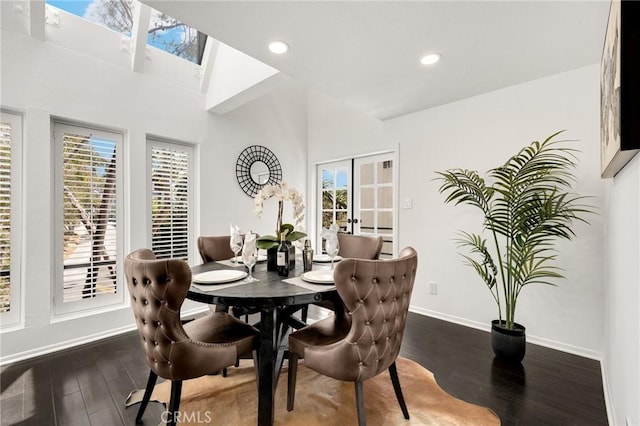 11601 Montana Ave Unit 7, Los Angeles, CA 90049 - dining space featuring wood finished floors, recessed lighting, a towering ceiling, a skylight, and french doors