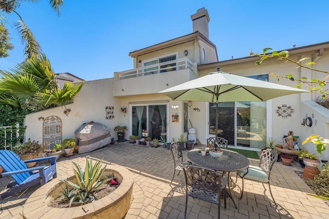 4843 Flying Cloud Way, Carlsbad, CA 92008 - back of property featuring a patio, stucco siding, and a chimney