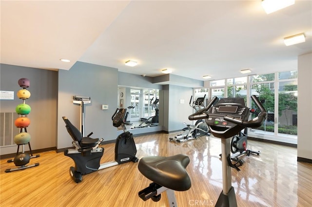 411 W Seaside Way Unit 402, Long Beach, CA 90802 - gym featuring plenty of natural light, wood finished floors, and recessed lighting