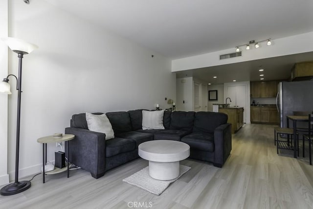 411 W Seaside Way Unit 402, Long Beach, CA 90802 - living room featuring light wood finished floors