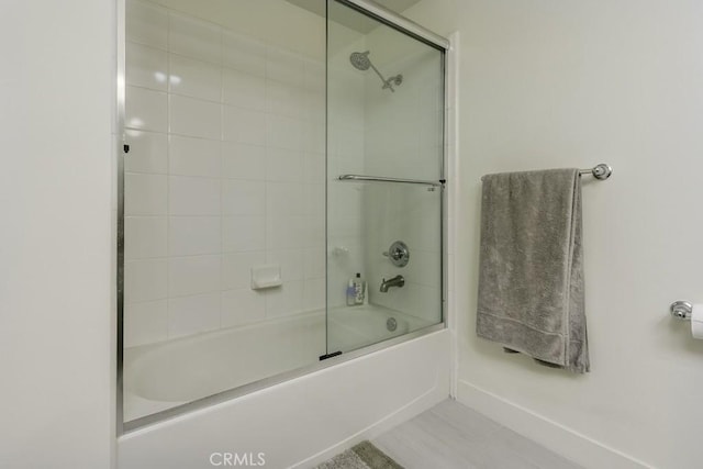 411 W Seaside Way Unit 402, Long Beach, CA 90802 - bathroom with bath / shower combo with glass door and baseboards