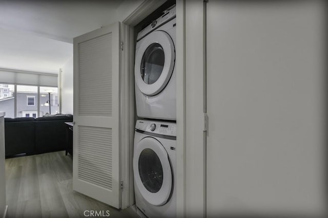 411 W Seaside Way Unit 402, Long Beach, CA 90802 - laundry room with stacked washer / drying machine and wood finished floors