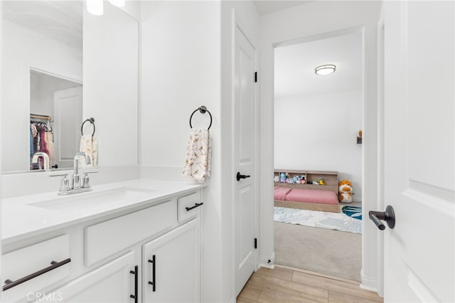 32886 Birchall Ct, Winchester, CA 92596 - bathroom featuring vanity, wood finished floors, ensuite bathroom, and a spacious closet