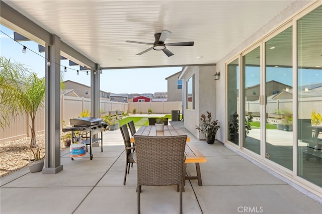 32886 Birchall Ct, Winchester, CA 92596 - fenced backyard with a patio area, a ceiling fan, and outdoor dining space