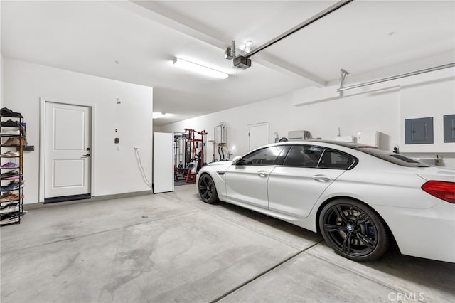 32886 Birchall Ct, Winchester, CA 92596 - garage featuring electric panel and a garage door opener