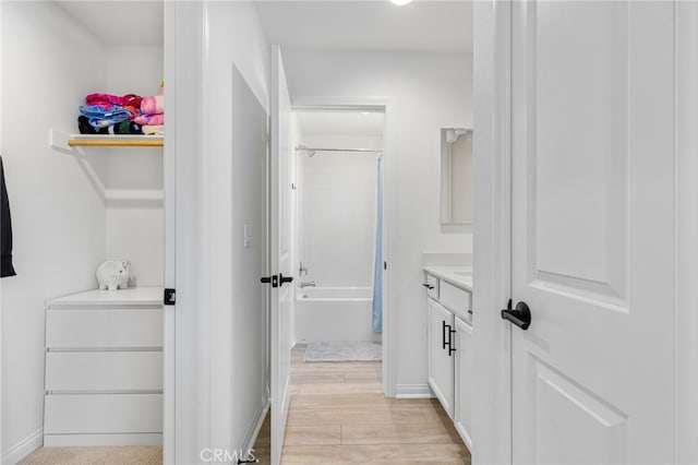 32886 Birchall Ct, Winchester, CA 92596 - full bathroom with vanity, washtub / shower combination, and wood finished floors
