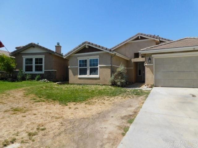 1203 Buckwheat Trl, Campo, CA 91906 - ranch-style house featuring driveway, a garage, stucco siding, a tile roof, and a front yard