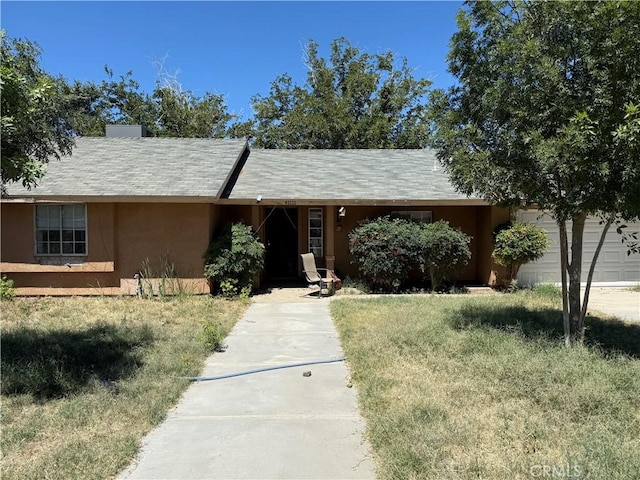 41111 172nd St E, Lancaster, CA 93535 - single story home with stucco siding, concrete driveway, and a front yard