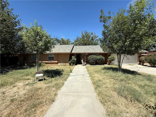 41111 172nd St E, Lancaster, CA 93535 - ranch-style house with concrete driveway, a front yard, and a garage