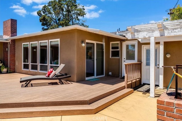923 Farroll Ave, Arroyo Grande, CA 93420 - rear view of property featuring stucco siding, a deck, and a chimney
