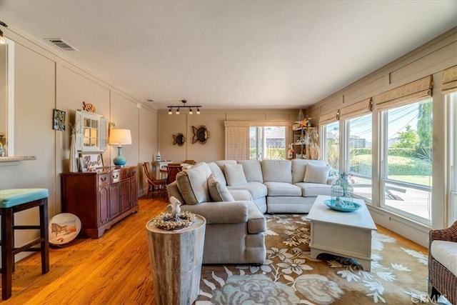 923 Farroll Ave, Arroyo Grande, CA 93420 - living area featuring light wood finished floors and ornamental molding