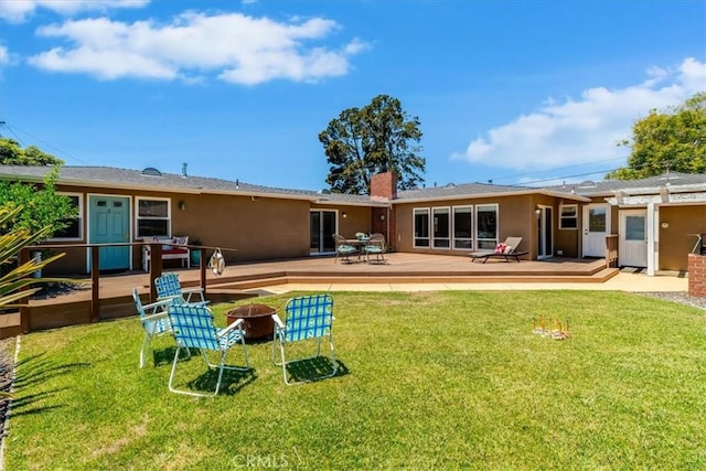 923 Farroll Ave, Arroyo Grande, CA 93420 - back of house with an outdoor fire pit, a deck, a chimney, a yard, and stucco siding