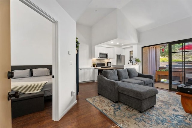 1046 Calle Del Cerro Unit 408, San Clemente, CA 92672 - living area with dark wood finished floors and high vaulted ceiling
