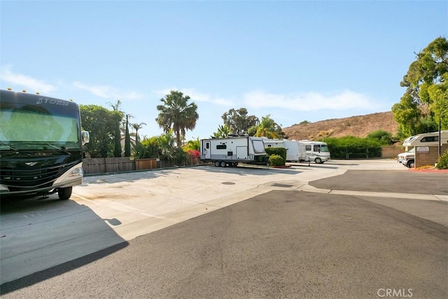 1046 Calle Del Cerro Unit 408, San Clemente, CA 92672 - view of front of property featuring uncovered parking and a mountain view