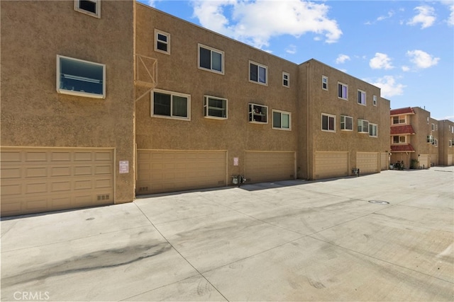 17910 River Cir Unit 5, Canyon Country, CA 91387 - view of building exterior featuring a garage