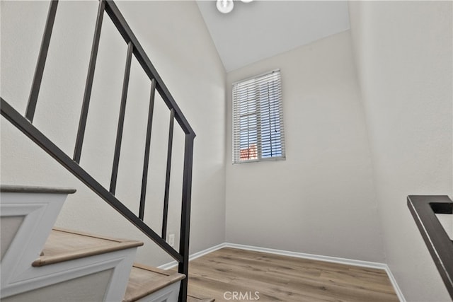 17910 River Cir Unit 5, Canyon Country, CA 91387 - staircase featuring wood finished floors and lofted ceiling