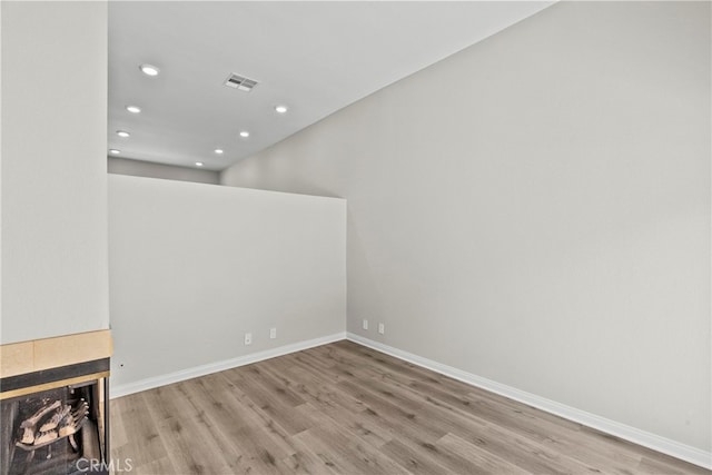 17910 River Cir Unit 5, Canyon Country, CA 91387 - unfurnished living room featuring wood finished floors, recessed lighting, and a fireplace