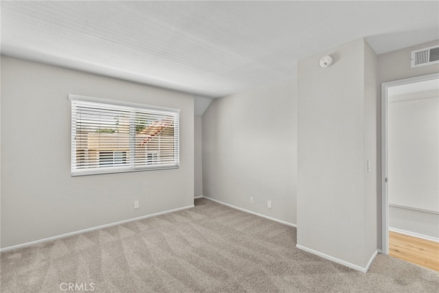 17910 River Cir Unit 5, Canyon Country, CA 91387 - spare room featuring carpet floors and a smoke detector