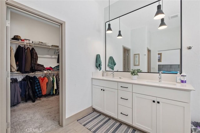 1938 N Frontier St, Hanford, CA 93230 - bathroom featuring double vanity and a spacious closet