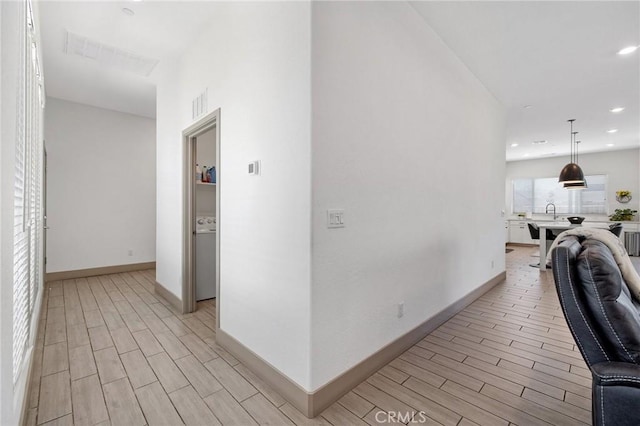 1938 N Frontier St, Hanford, CA 93230 - corridor featuring wood tiled floors and recessed lighting