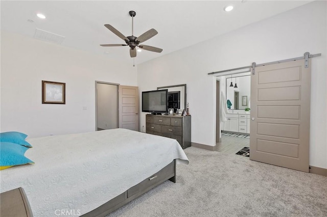 1938 N Frontier St, Hanford, CA 93230 - carpeted bedroom featuring a barn door, recessed lighting, connected bathroom, vaulted ceiling, and ceiling fan
