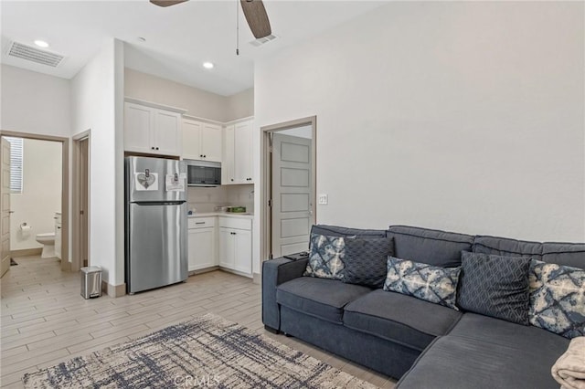 1938 N Frontier St, Hanford, CA 93230 - living room featuring ceiling fan, light wood finished floors, and recessed lighting