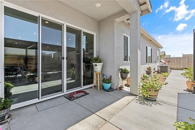 1938 N Frontier St, Hanford, CA 93230 - property entrance featuring a patio and stucco siding