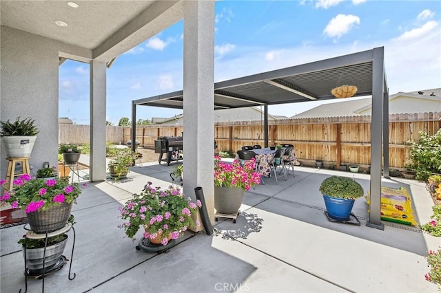 1938 N Frontier St, Hanford, CA 93230 - fenced backyard featuring outdoor dining space and a patio area