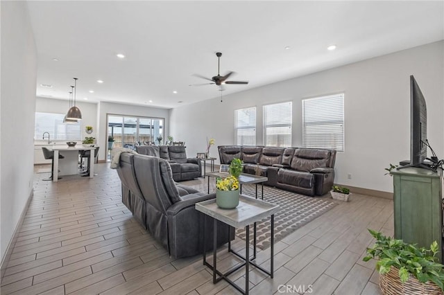 1938 N Frontier St, Hanford, CA 93230 - living room featuring wood tiled floors, a ceiling fan, and recessed lighting