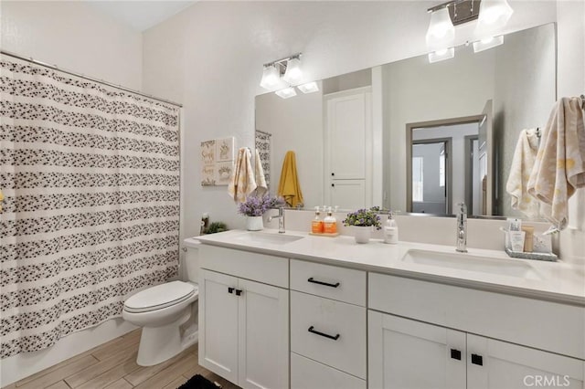 1938 N Frontier St, Hanford, CA 93230 - full bath with double vanity, a shower with shower curtain, and wood finished floors